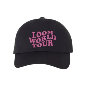 Black dad hat with curved brim featuring bold pink embroidered text that reads LOOM WORLD TOUR on the front inspired by Imagine Dragons merch